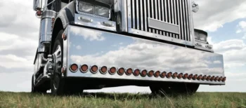 A close up of the front end of a semi truck