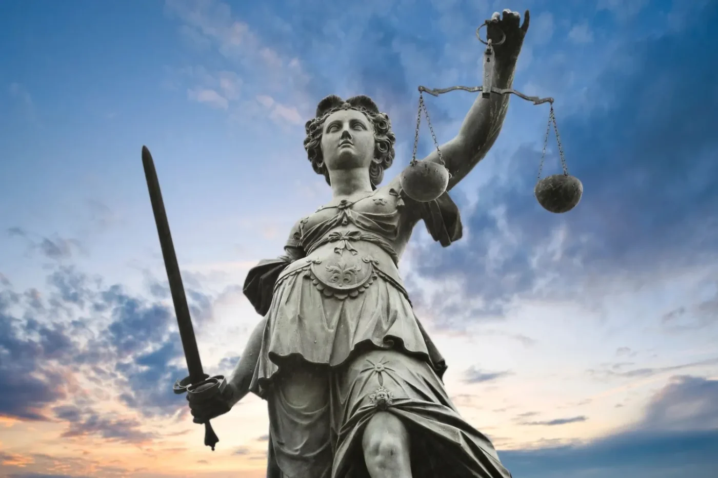 A statue of lady justice holding the scales and sword.