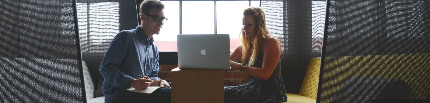 qtq80-zaxyqH Two people sitting on a couch with laptops
