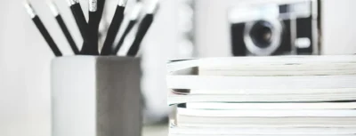 A close up of some pencils and books