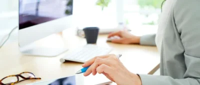 A person is using their tablet at the table