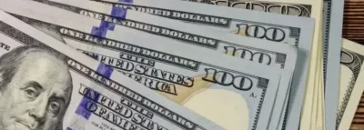 A close up of some hundred dollar bills