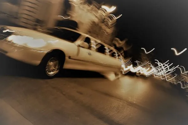 an-abstract-blur-of-a-white-limousine-in-the-city-at-night-with-light-trails_rKmxeYASi-3 (1)