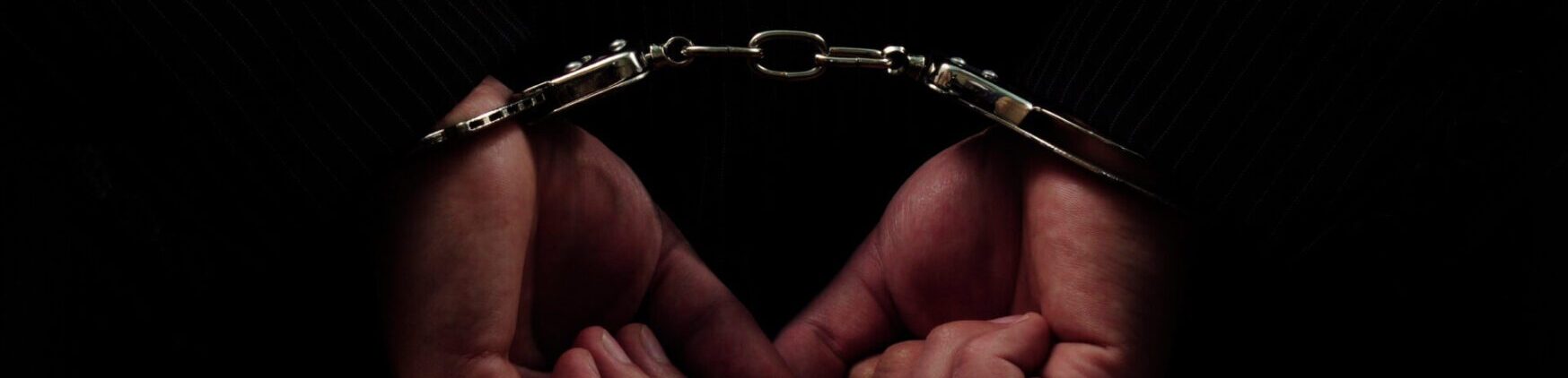 hands in handcuffs cropped