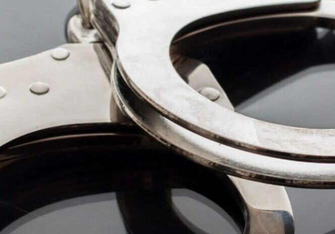 A pair of handcuffs on top of a table.