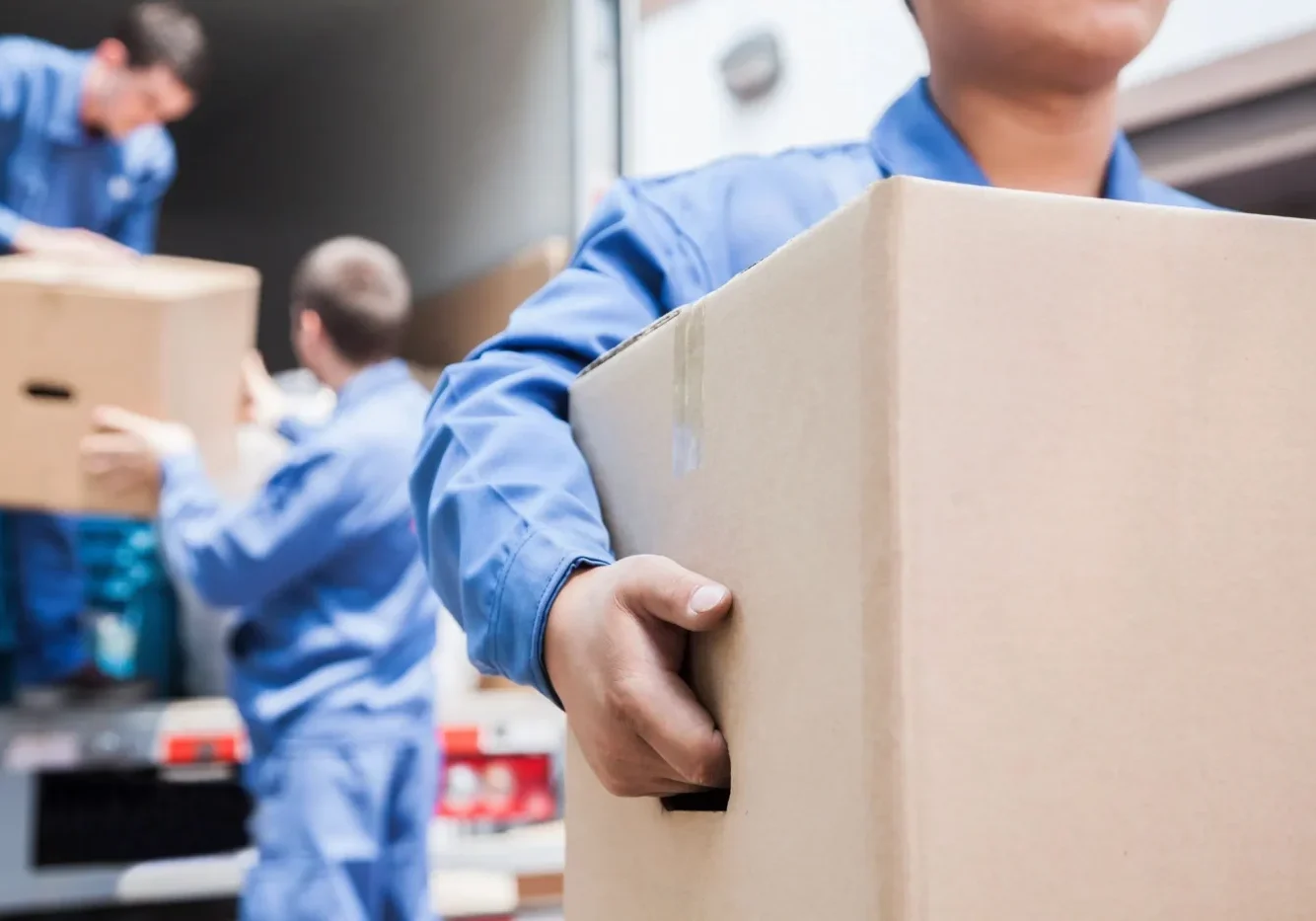 A man holding a box in his hand.