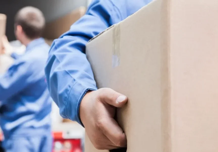 A man holding a box in his hand.