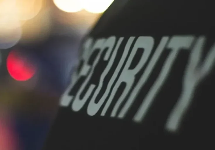 A security guard is seen in the background.