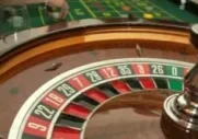A roulette wheel with the number twenty eight on it.
