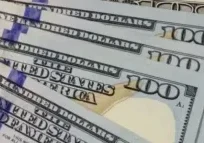 A close up of some hundred dollar bills