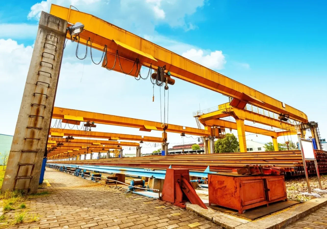 A large crane is in the middle of an industrial area.