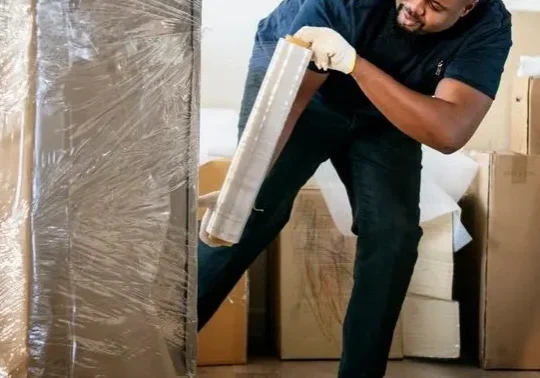 qtq80-ztRrYV A man is moving furniture in the house