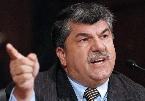 A man with a beard and mustache wearing a suit